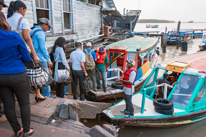 Commuters board passenger boats in Georgetown Guyana Commuters waiting to board a passenger boat in Guyana
